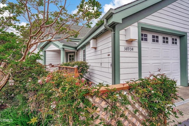 view of side of property featuring a garage