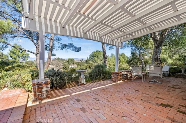 view of patio featuring a pergola