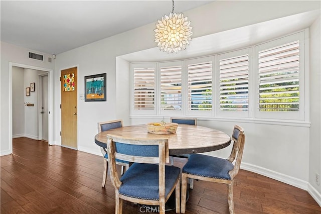 dining area with dark hardwood / wood-style floors