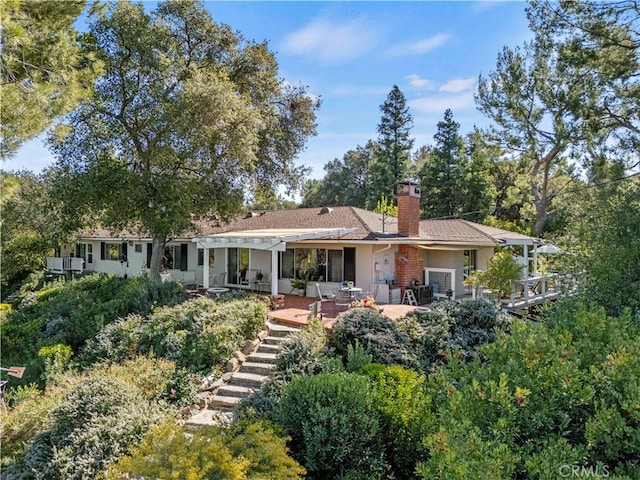 back of property featuring a patio