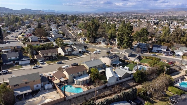 birds eye view of property featuring a mountain view and a residential view