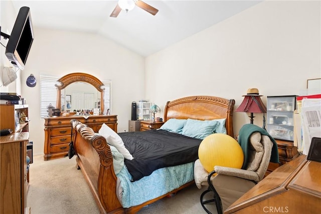 carpeted bedroom with ceiling fan and lofted ceiling