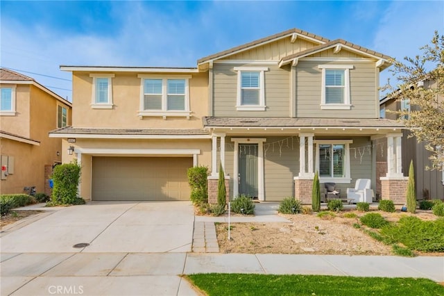 craftsman-style home featuring a garage and a porch