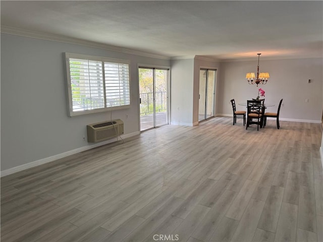 interior space with baseboards, a wall mounted air conditioner, light wood-style flooring, and crown molding