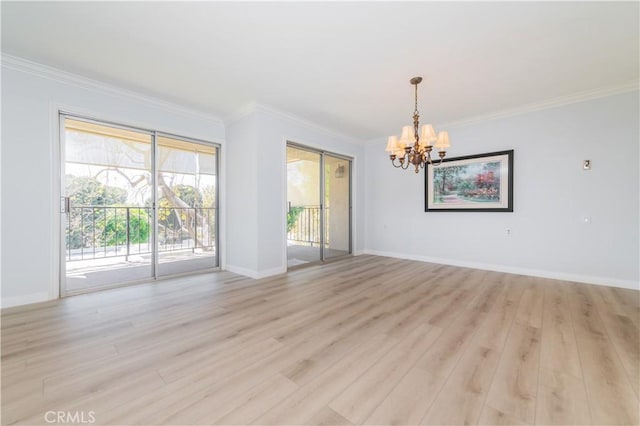2381 Via Mariposa W Unit 2C, Laguna Woods, CA 92637 - empty room with a chandelier, ornamental molding, light wood finished floors, and baseboards