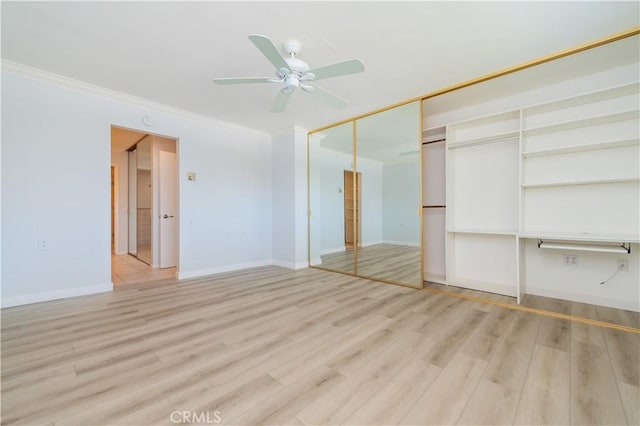 2381 Via Mariposa W Unit 2C, Laguna Woods, CA 92637 - unfurnished bedroom with ornamental molding, wood finished floors, baseboards, a closet, and ceiling fan