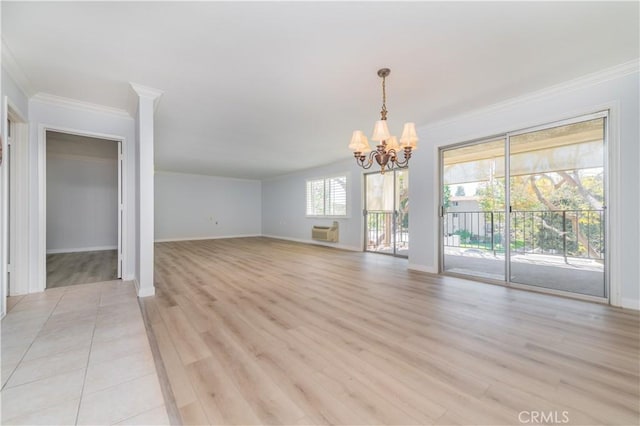 2381 Via Mariposa W Unit 2C, Laguna Woods, CA 92637 - unfurnished dining area with a chandelier, ornamental molding, baseboards, an AC wall unit, and light wood-type flooring