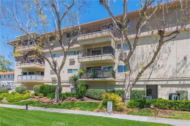 2381 Via Mariposa W Unit 2C, Laguna Woods, CA 92637 - view of apartment building / complex