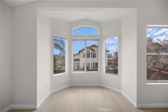 interior space with light wood-style flooring and baseboards