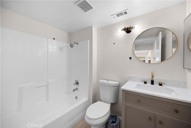 full bathroom with toilet, bathtub / shower combination, visible vents, and vanity