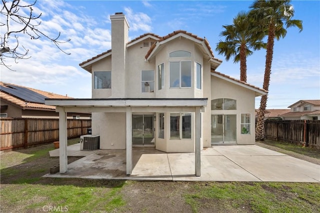 back of property with a patio area, a fenced backyard, and stucco siding