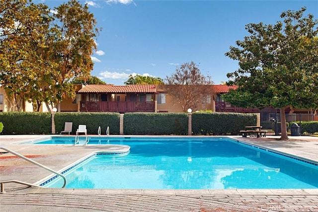 view of pool featuring a patio