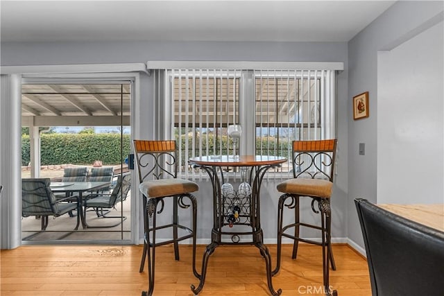 dining space featuring wood-type flooring