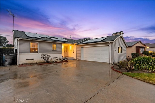 ranch-style home featuring a garage