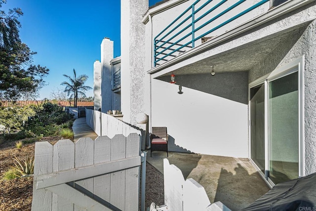 656 Westlake St, Encinitas, CA 92024 - view of side of home featuring stucco siding and a balcony
