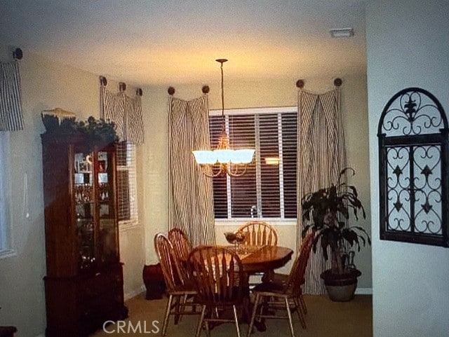 dining room featuring a chandelier