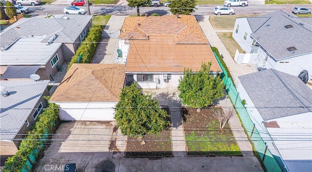 birds eye view of property with a residential view