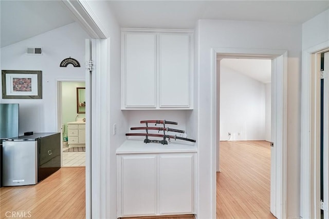 interior space with sink and light wood-type flooring