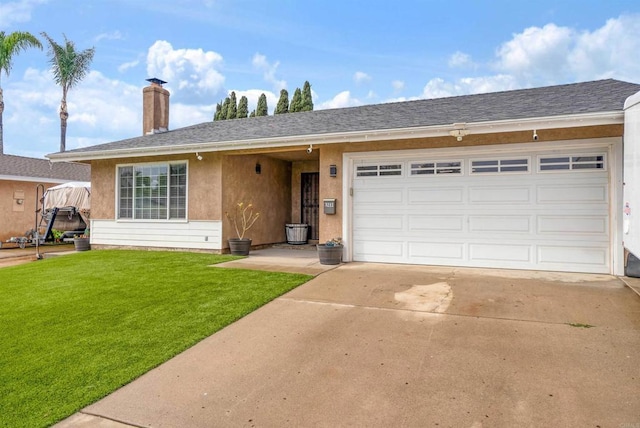 ranch-style house featuring a garage and a front yard