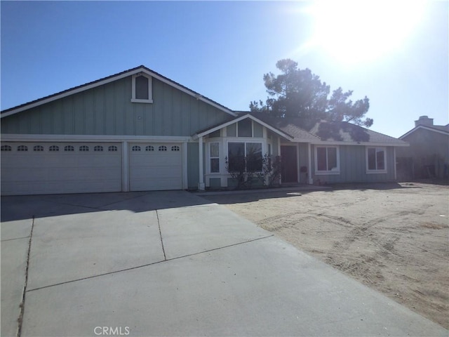 single story home with a garage