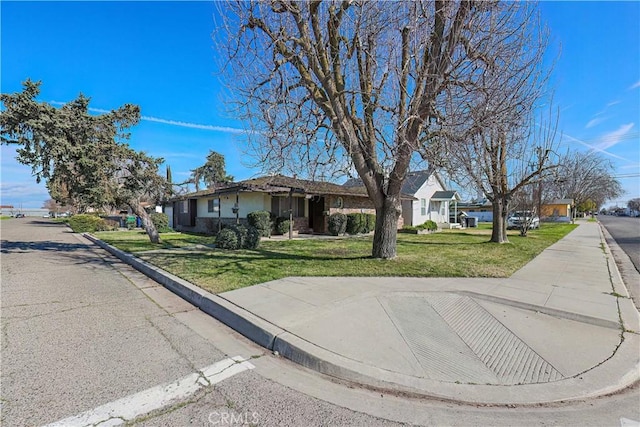 ranch-style house with a front yard