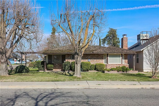 view of front of home with a front yard