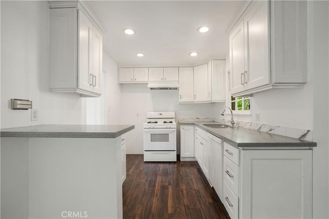 kitchen featuring sink, dark wood-type flooring, white cabinets, and white appliances