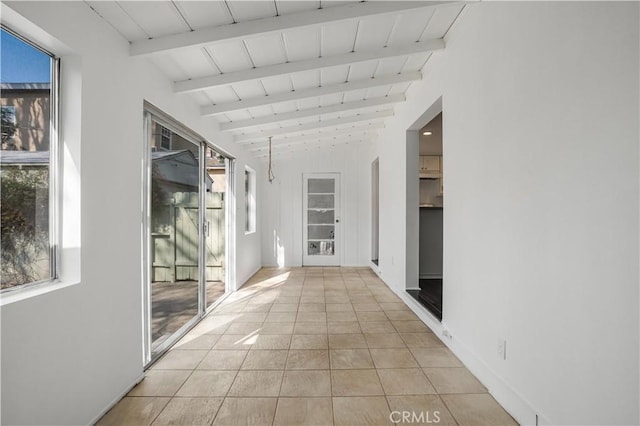 hallway featuring light tile patterned floors, wood ceiling, and vaulted ceiling with beams