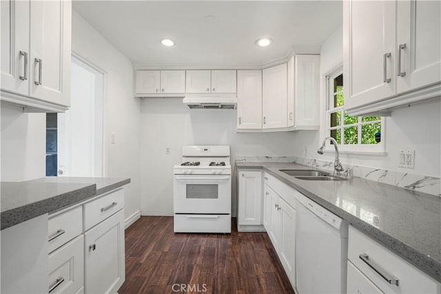 kitchen with white cabinetry, white appliances, sink, and stone counters