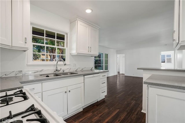 kitchen featuring white cabinetry, sink, dark wood-type flooring, and dishwasher