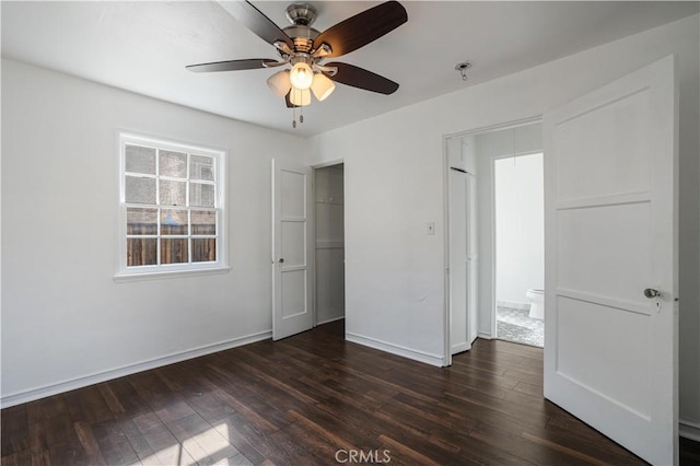 unfurnished bedroom featuring dark hardwood / wood-style floors and ceiling fan