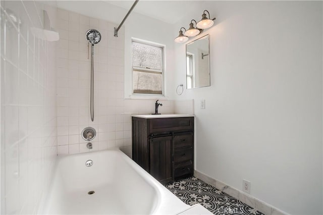 bathroom featuring vanity and tiled shower / bath combo