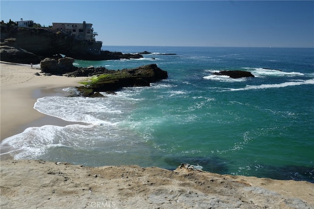 property view of water featuring a beach view