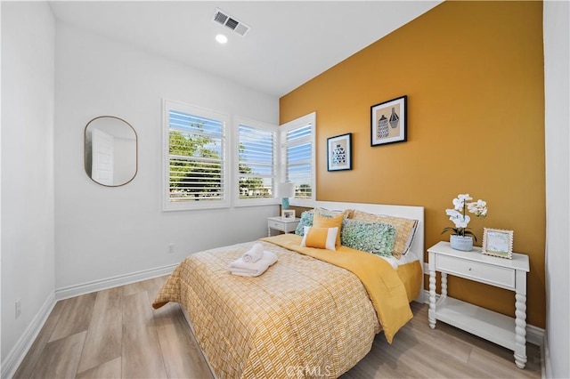 bedroom featuring light wood-type flooring