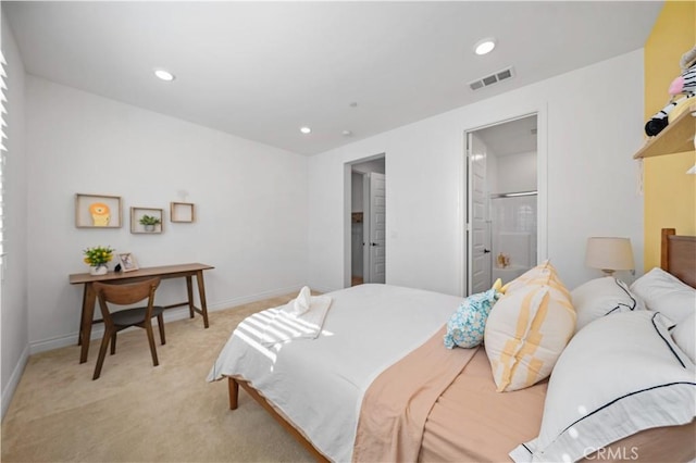 bedroom with light colored carpet