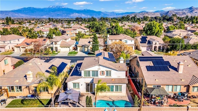 birds eye view of property with a residential view and a mountain view