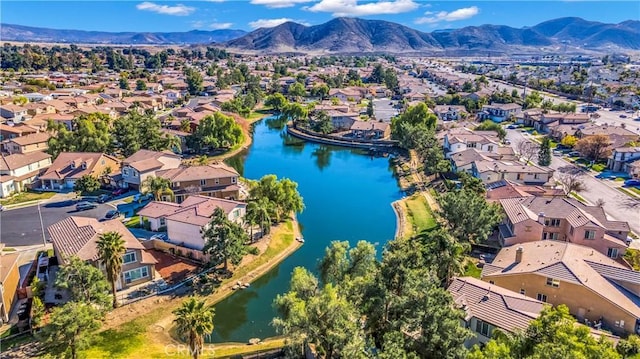 aerial view featuring a residential view and a water and mountain view