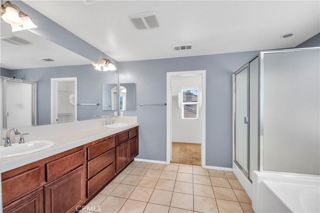 full bathroom with a stall shower, visible vents, and a sink