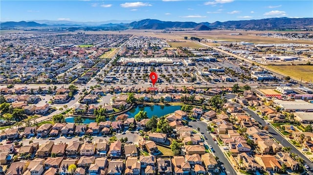 bird's eye view with a residential view and a water and mountain view