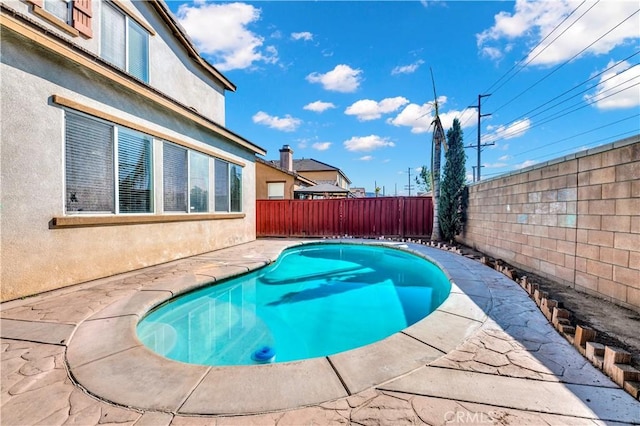 view of pool featuring a fenced in pool and a fenced backyard