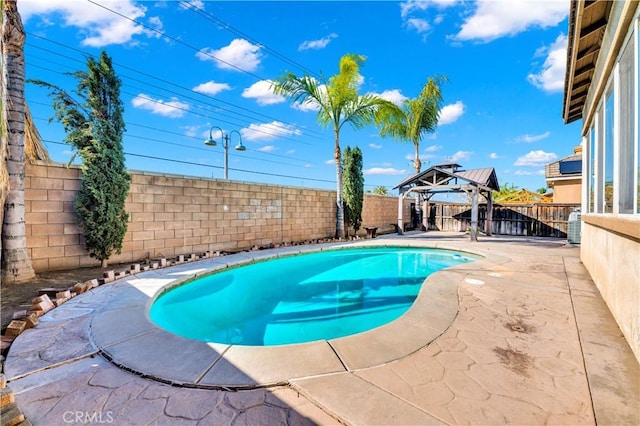 view of pool featuring a fenced in pool, a fenced backyard, a patio, and a gazebo