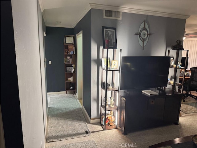 carpeted living room with ornamental molding and ceiling fan