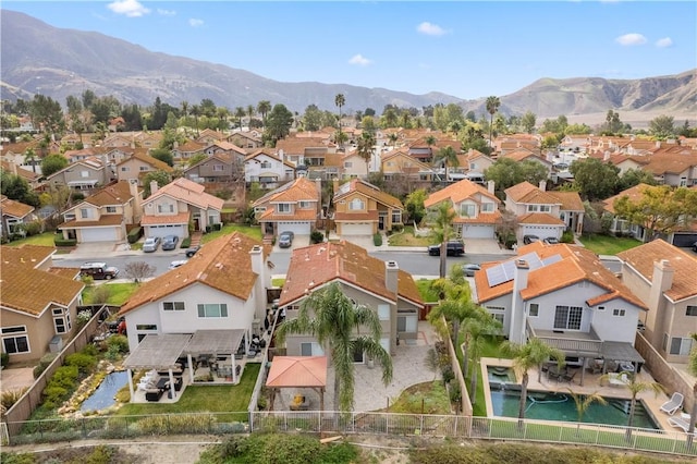 drone / aerial view with a mountain view and a residential view