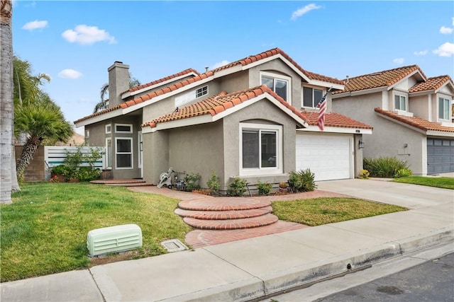 mediterranean / spanish-style home with a garage, concrete driveway, a tiled roof, a front lawn, and stucco siding