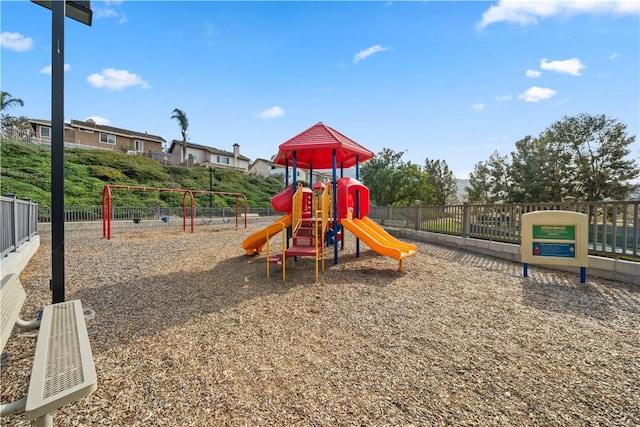 communal playground featuring fence