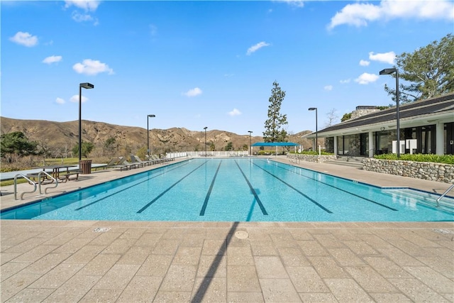 community pool with a mountain view