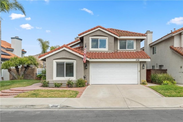 mediterranean / spanish home featuring driveway, a tile roof, fence, and stucco siding