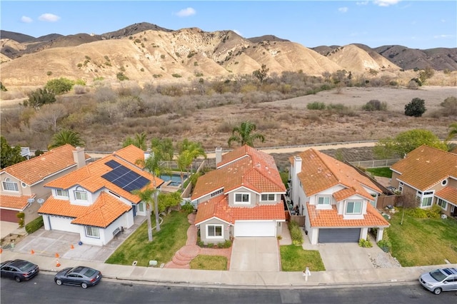 birds eye view of property featuring a residential view and a mountain view