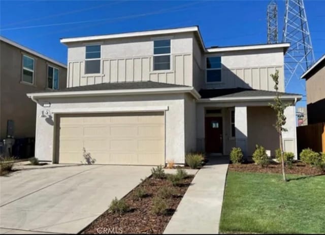 view of front facade featuring a garage, driveway, stucco siding, a front lawn, and board and batten siding