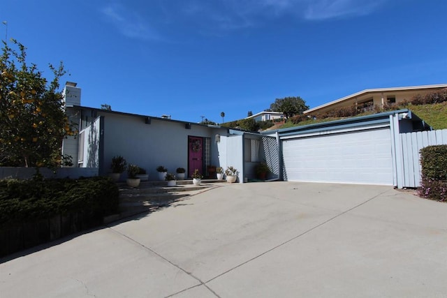 ranch-style home featuring a garage